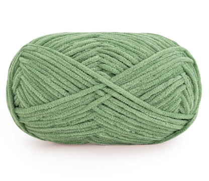 Green skein of yarn on a white background